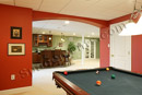 This finished basement in Limerick, PA was designed to comfortably fit a pool table, wet bar and home gym.