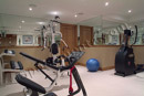 The home gym in this finished basement in Montgomery County, PA feels bright and open.