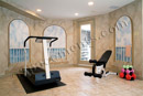 The custom mural in this exercise room in this finished basement in Exton, PA creates an enjoyable place to work out.