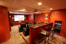 This finished basement in Chester County, PA provides an example of a spacious home theater built within an odd space.