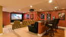 This finished basement in Collegeville, PA has a home theater modeled after a stadium superbox.