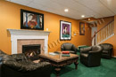 This finished basement in Collegeville, PA has an intimate gathering area to enjoy conversation by the fireplace.