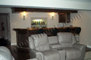 This finished basement in Royersford, PA has a wet bar overlooking the family room.