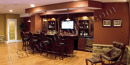 This finished basement in Phoenixville, PA has a custom mahogany wet bar.